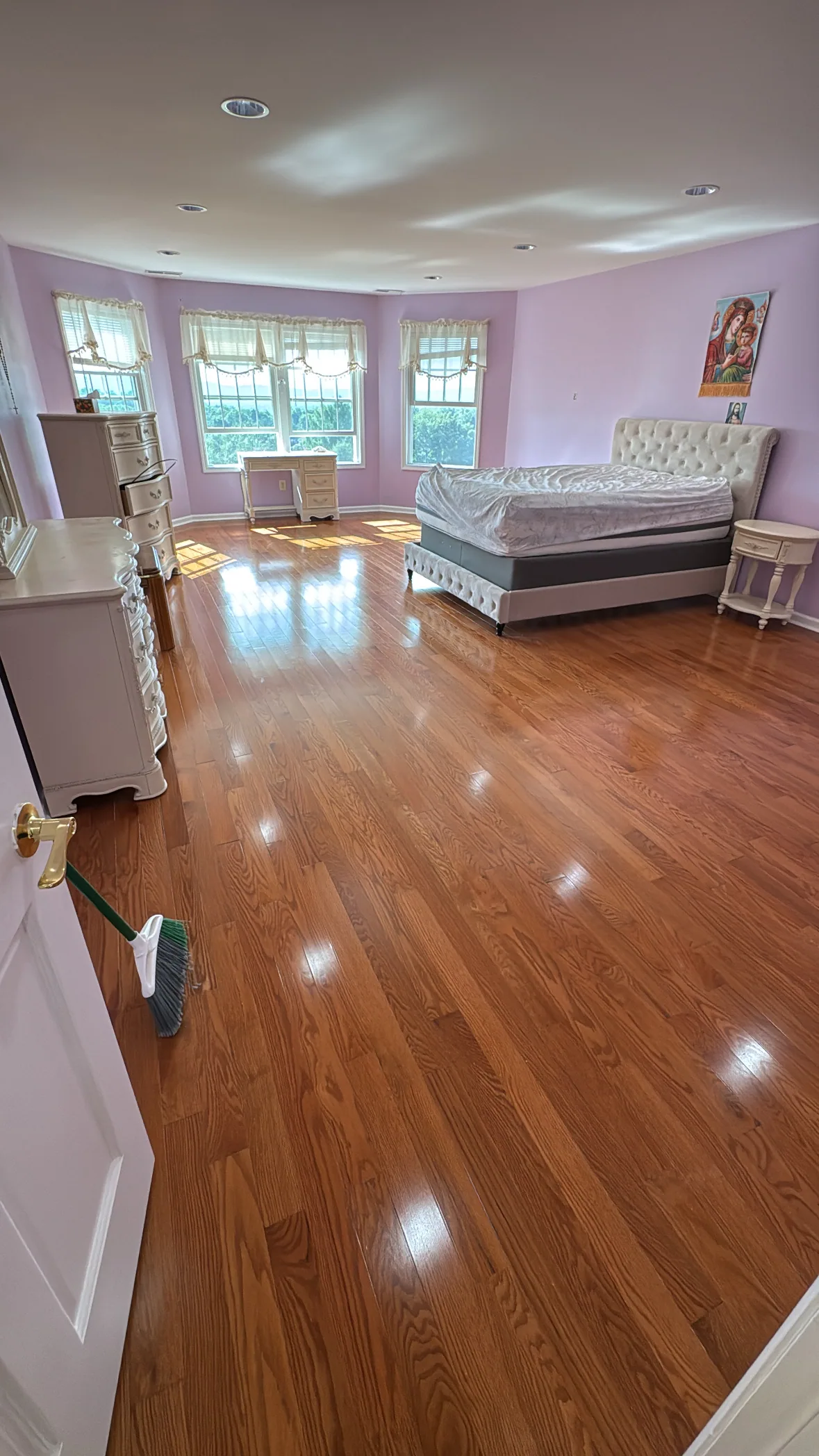 Glossy red oak hardwood in a bedroom
