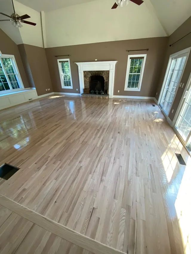 Light natural refinish in a great room with a fireplace