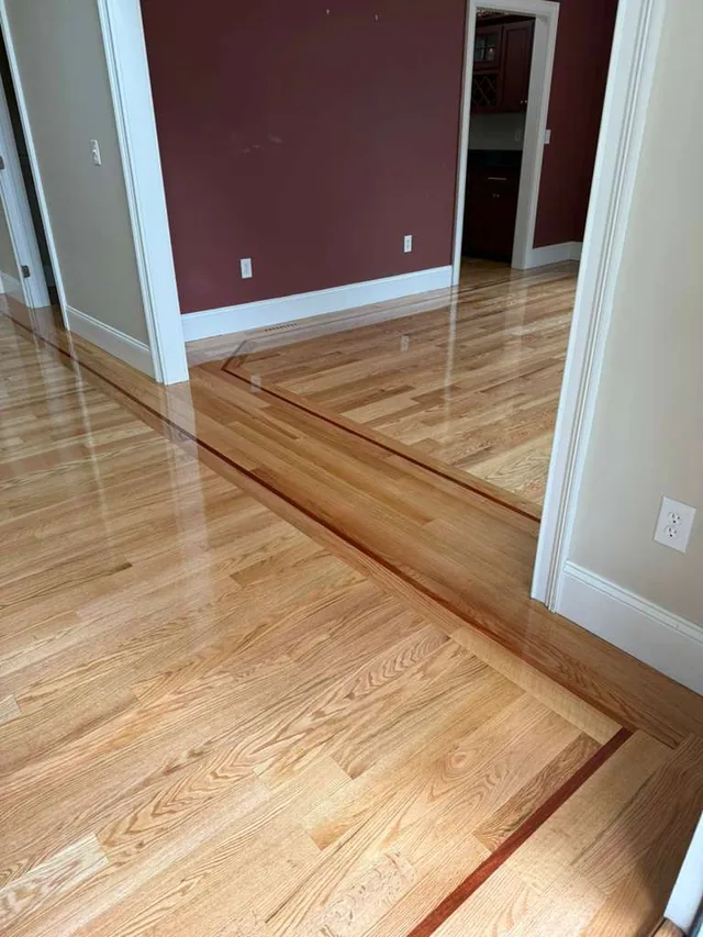 Natural oak floor with a dark contrasting border