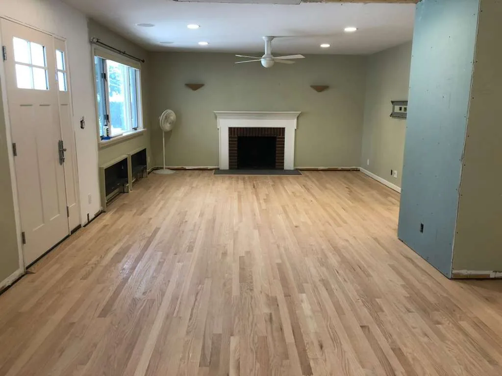New unfinished hardwood installed in a living room