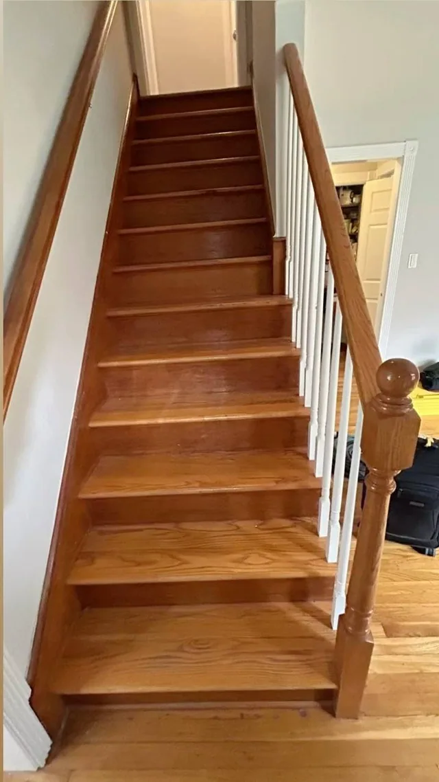 Refinished oak staircase with white balusters