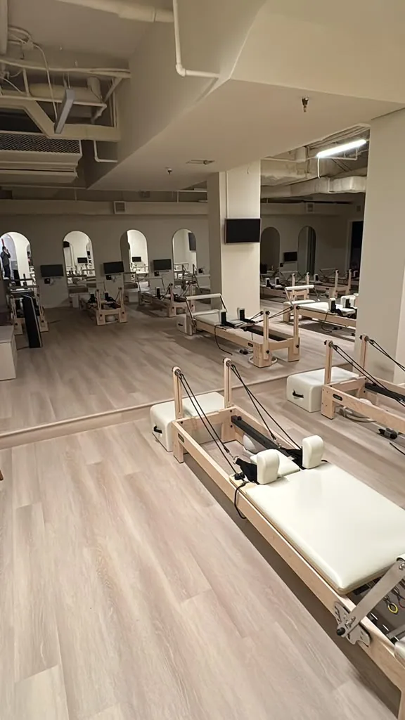 Light plank flooring installed in a Pilates studio