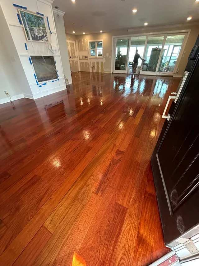 Red-toned oak with a high-gloss finish in an open living area