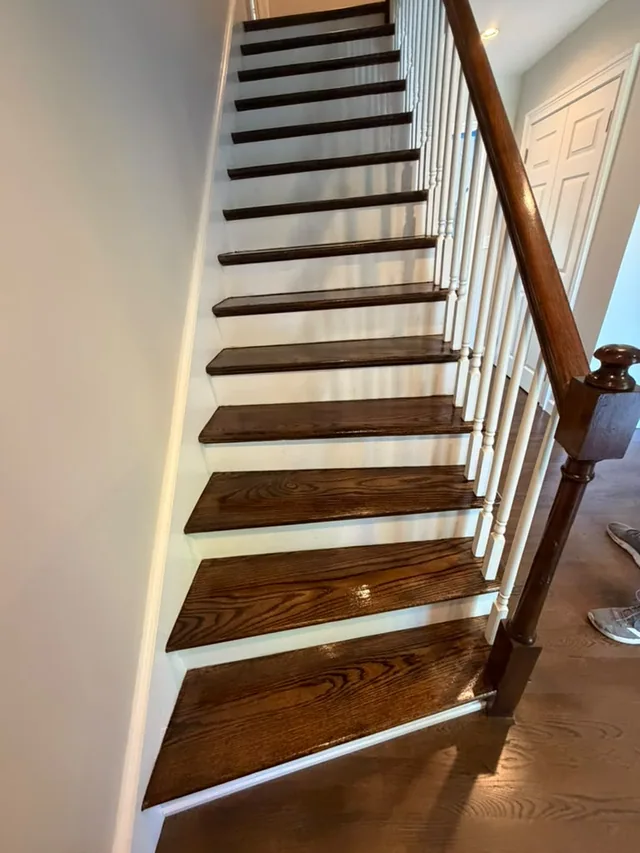 Staircase refinished with dark stained treads and white risers